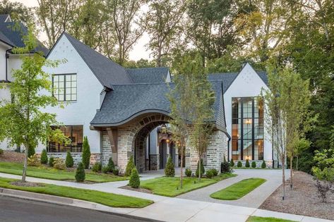 English Tudor style home with a beautiful modern twist in South Carolina Tudor Style Barndominium, Modern Tudor Interior Design, Modern French Tudor, Tudor Style Homes Plans, French Tudor Style Homes, Modern Tudor House Exterior, Beach House Getaway, English Tudor Homes, Modern Tudor