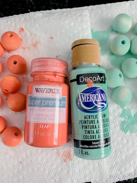 Painted wood bead hack Painted Wood Bead Garland Diy, Best Way To Paint Wooden Beads, Painting Wooden Beads Diy, Easy Way To Paint Wooden Beads, Painting Beads Wooden, How To Paint Wood Beads, How To Dye Wood Beads, How To Paint Wooden Beads, Wooden Bead Crafts Diy