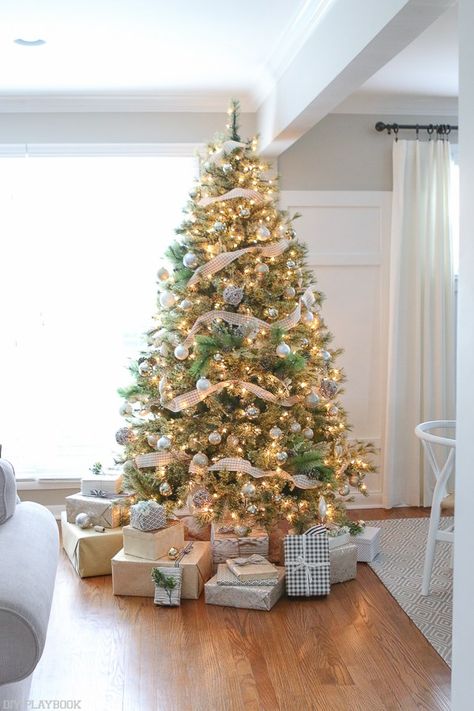 Loving this neutral & glam Christmas tree look. Picking one color scheme for your tree can really make the entire look cohesive. We chose patterned paper from Homegoods to wrap the presents, and they look like decor underneath the tree. The buffalo check paper form Homegoods is a personal favorite! (Sponsored Pin) Neutral Christmas Tree, Glam Christmas Tree, Amazing Christmas Trees, Silver Christmas Decorations, Buffalo Check Christmas, Neutral Christmas, Glam Christmas, Idea Room, Beautiful Christmas Trees