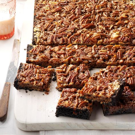 Not Your Mama's Seven-Layer Bars Recipe -The addition of dulce de leche makes this a decadent new take on traditional seven-layer bars. You can cut this recipe in half and make it in an 8x8-in. pan. —Andrea Barlow, Hot Springs, Arkansas Packaged Cookies, Seven Layer Cookies, Seven Layer Bars, Magic Cookie Bars, Easy Easter Desserts, Layer Bars, Potluck Desserts, Bakery Items, Fudgy Brownie