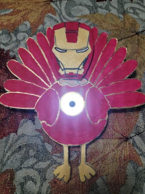 We used a rechargeable keyring flashlight as ironman's chest, cut out the turkey, and glued it to foam board to make it sturdy. We then used thin cardboard, similar to a soda box, for his mask. We also added a small piece of tape to hold the mask down, and be able to lift it up to see the turkeys face. Gingerbread Turkey Disguise, Disguise A Turkey Mcdonalds, Disguise A Turkey Iron Man, Funny Turkey Disguise Project, School Turkey Project Disguise, Mario Turkey In Disguise, Into Spiderverse, Gingerbread Disguise, Turkey Kindergarten