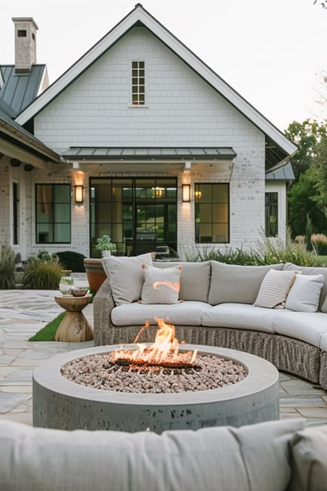 A fire pit serves as a focal point and gathering spot on cool evenings. It adds warmth and ambiance, making your patio a year-round destination for relaxation and socializing. Outdoor Seating Fire Pit, Extended Patio With Fire Pit, Outdoor Patio And Fire Pit, Fire Pit On Deck Ideas, Outdoor Firepit Patio, Fire Pit On Concrete Patio, Backyard Pool And Fire Pit Ideas, Dream Patio Outdoor Living Spaces, Pool And Fire Pit Ideas Backyards