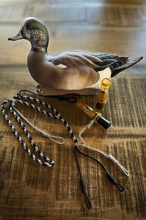 Pictured is a duck decoy along side duck calls and a call lanyard to hold your calls Duck Call Lanyard, Waterfowl Hunting Gear, Duck Hunting Blinds, Hunting Fashion, Hunting Calls, The Cinch, Duck Hunting Gear, Waterfowl Hunting, Duck Calls