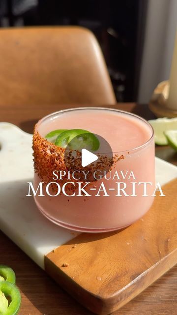 134K views · 13K likes | Nikki Sips 🤘🏻🍸 on Instagram: "Made this for the hundreds of sweet souls who asked for a mocktail version of my viral spicy guava margarita from last month.  She’s spicy, sweet, and frozen— you almost forget the alcohol is missing.  Happy Mocktail Monday my friends! 🫶🏼☺️☀️

____

Spicy Guava Mock-a-Rita

You’ll Need:
2 oz guava syrup (linked in Amazon storefront)
2 oz jalapeño infused pineapple juice (easy recipe below)
1 oz cream of coconut 
1 lime, juiced
Scoop of ice
Tajin (I am who I am)
Agave
2 jalapeño slices 

Prepare your glass by painting with agave and dipping into tajin.  In a blender, combine guava, lime juice, pineapple, cream of coconut, and ice.  Blend until smooth.  Pour into prepped glass and garnish with two jalapeño slices. ☀️🌶️

____

Jalap Spicy Guava Margarita, Spicy Mocktail Recipe, Guava Mocktail, Homemade Spirits, Guava Drink, Guava Syrup, Guava Margarita, Cream Of Coconut, Who Asked