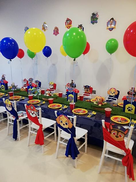 Paw Patrol Themed Food, Paw Patrol Table Decorations, Chase Birthday Party, Paw Patrol Centerpiece, Paw Patrol Birthday Decorations, Kid Birthday Outfits, Paw Patrol Birthday Theme, Paw Patrol Decorations, Baby First Birthday Themes