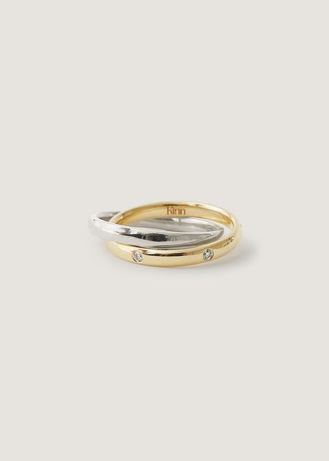 Kinn x Rachel Nosco Exclusive Celebrate a modern milestone. This ring features two interlocking bands, with six 0.012ctw diamonds burnish set in 14k solid gold. Solid comfort fit band.Lab created diamonds.This ring fits true to size. This piece cannot be resized. 14k solid gold & sterling silver. Weight: 7.93g Band width: 3mm Total carat weight: 0.13ctw Diamond shape: Round Diamond clarity: VS2 Diamond color: F/G This piece is made to order. Please allow at least 10-15 business days for producti Interlocking Ring, Fall Rings, Gold And Silver Rings, Dope Jewelry, Classy Jewelry, Jewelry Lookbook, Ring Fit, Jewelry Inspo, Dream Jewelry