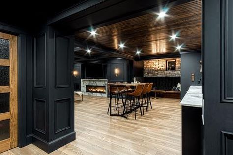 Basement Pub Ideas Wall, Dark Modern Basement Ideas, Game Room Bar Ideas Basement Designs, Modern Farmhouse Finished Basement, Cozy Basement Bar, Cabin Style Basement Ideas, Basement Modern Design, Basement Lodge Theme, Black Trim Basement