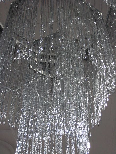 Tinsel Chandelier Tinsel Chandelier, Onda Disco, Theatre Ideas, Winter Wonderland Theme, Balloons Decorations, Martha Stewart Crafts, New Years Eve Weddings, Silver Theme, Silver Tinsel