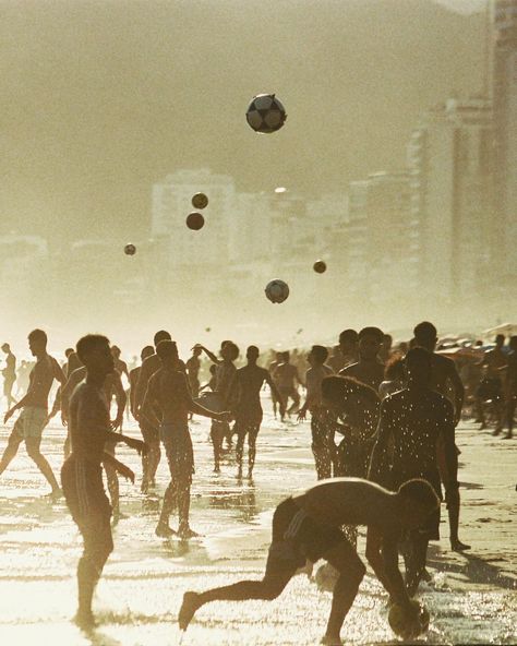 Dive into the heart of Rio de Janeiro's iconic beaches through the lens of Rafael Moura. As the golden sands come alive with locals and tourists alike, a group engrosses in a spirited game of beach ball. Their silhouettes, moving in harmony against the backdrop of the vast azure sea, epitomize the city's soulful rhythm. The film's grainy texture magnifies the nostalgia, bringing out the raw emotions and vibrant colors - from the sun-kissed tans to the cerulean waves. Cinematic Dance, Shot On Film, Brand Manual, Principles Of Art, Beach Ball, Cinematic Photography, Summer Feeling, On Film, Reference Images