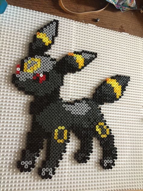 Umbreon perlers beads Perler Bead Umbreon, Umbreon Perler Bead Pattern, Umbreon Perler Beads, Gengar Perler Beads, Umbreon Pixel Art, Umbreon Perler, Pokémon Perler Beads, Perler Bead Pokemon Patterns, Perler Beads Pokemon