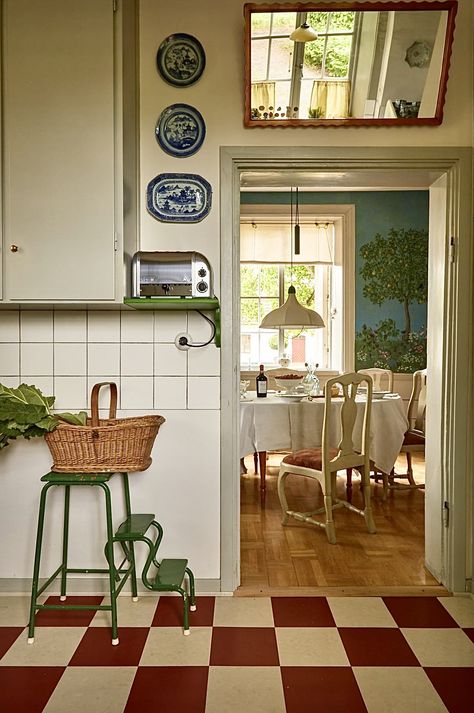 Of interest is the mirror hanging above the doorway, reflecting additional light into the space.... Beata Heuman, Swedish Cottage, Swedish House, Dream House Decor, Interior Inspo, House Inspo, 인테리어 디자인, House Inspiration, A Kitchen