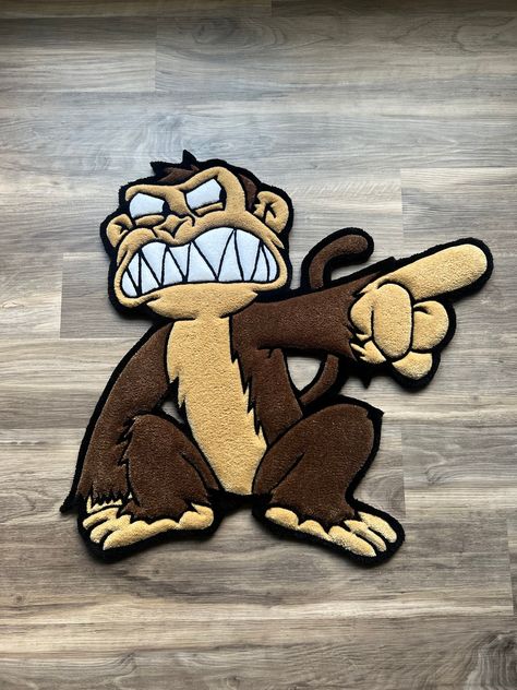 Handmade custom tufted Evil Monkey! Made To Orders take about 7-10 days to be made and shipped out depending on size! Each tufted rug is carefully crafted and carved to perfection giving an almost 3D appearance that you can see and feel. Each piece is a luxury decor addition to the interior floors of your home.  Also an amazing gift for your family or friends! I specialize in creating custom rugs from any design such as Business logos, Faces, Animals, Etc. via photos and I also offer graphic design assistants with original concepts to make your dreams a reality in rug form! - - - - - *Made with 100% hypoallergenic acrylic yarn. *All tufted rugs are extremely soft and durable with a felt backing finish on the back. *Keep the rug in a low traffic area and away from any moisture. *Use low wat Teddy Bear Rug, Mens Rug, Character Rugs, Custom Rugs Design, Rug Tufting Ideas, Rug Form, Rugs Custom, Tufting Diy, Make Your Dreams A Reality