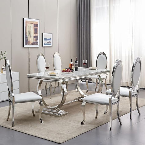 - Complete 7-piece dining set with white faux marble table and 6 leather upholstered chairs. - Faux marble tabletop made of 1.6 inch MDF with high-quality stainless steel pedestal base. - PU leather dining chairs with premium stainless steel legs for support and durability. - Ideal for everyday dining and gatherings, suitable for home, kitchens, and commercial spaces. - Water-resistant and easy to clean with a damp cloth. White Marble Dining Room, Marble Dining Room Table, Marble Kitchen Table, Silver Dining Table, Modern Marble Kitchen, Dining Table Set For 6, Marble Dining Room, Dining Room Table Marble, Formal Dining Room Sets