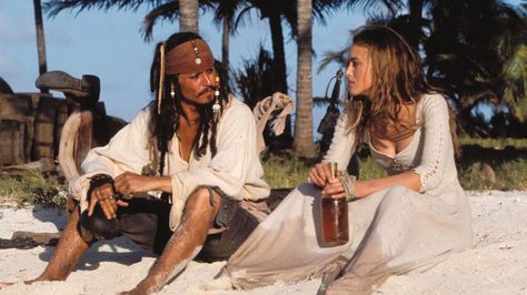 PIRATES OF THE CARIBBEAN ~ Captain Jack Sparrow and Elizabeth Swan have a 'heart to heart' chat and some rum after being stranded on a desert island. Jack Sparrow, A Man, The Beach