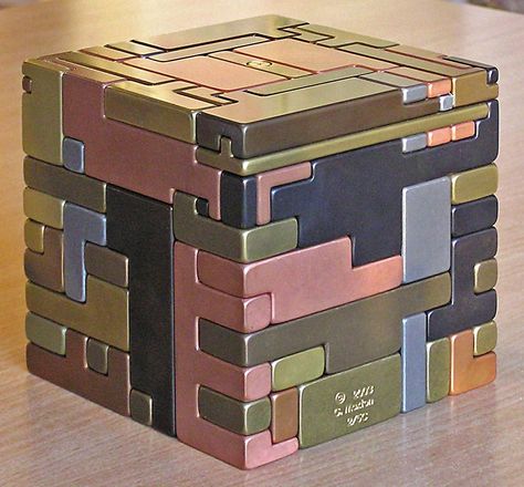 5" sq all metal puzzle. Pieces must be slid in a special sequence, hidden keys and hidden storage space. Idea from Japanese puzzle boxes. Japanese Puzzle Box, 3d Maze, Japanese Puzzle, Cnc Manufacturing, Puzzle Boxes, Woodworking Tools Workshop, Metal Puzzles, Window Projects, Secret Box