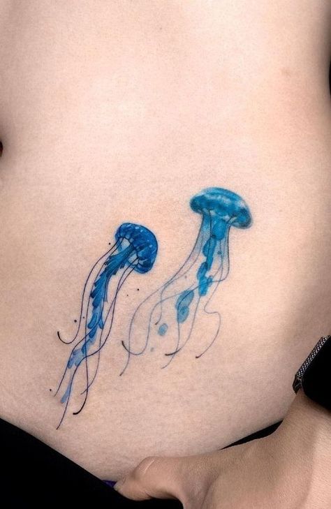 Discover the art of transformation with jellyfish tattoos in our article. Explore it and find 50+ stylish designs with meanings explained. Aquatic Tattoo, Blue Ink Tattoos, Studio Tattoo, Jellyfish Tattoo, Blue Tattoo, Feminine Tattoo, Spine Tattoo, Discreet Tattoos, Elegant Tattoos