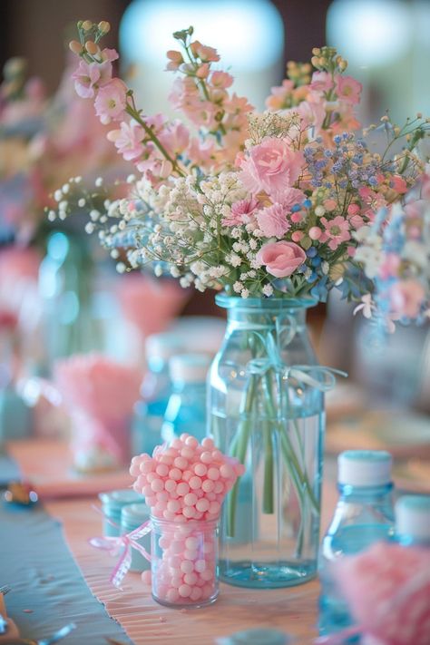 Elegant floral arrangement with pink and white flowers in a blue vase, surrounded by pastel-colored decorations and candy jars, perfect for a baby shower or spring event. Unique Gender Reveals, Fun Gender Reveal Ideas, Baby Gender Reveal Ideas, Unique Gender Reveal Ideas, Unique Gender Reveal Party Ideas, Baseball Gender Reveal, Unique Gender Reveal, Pumpkin Gender Reveal, Simple Gender Reveal