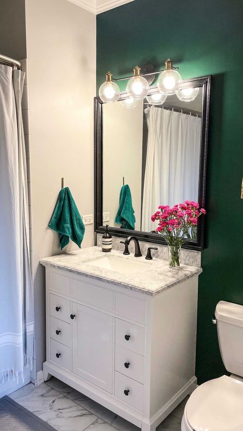 jesslynnpo on Instagram: Before and after of our bathroom renovation✨ The green accent wall is Essex Green by Benjamin Moore✨The Paris print is by @everydayparisian… Essex Green Bathroom, Benjamin Moore Essex Green, Green Accent Wall, Essex Green, Removable Backsplash, White Marble Kitchen, Green Accent Walls, Downstairs Bathroom, Decorative Mouldings