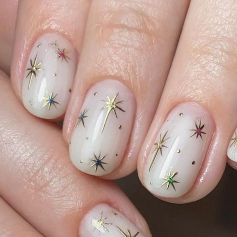 @ashley_thatnailbabe on Instagram: "Twinkle twinkle little star…. ✨🌙  Prep |  @officialnavyprofessional  @willowacademy_lj   Created using | @the_gelbottle_inc   Topped with @lunuluxe | Velvet Bloom  #nails #nailtech #buildergel #thegelbottleinc #navyprotools #nailart #naturalnails #buildergel #handdrawnnailart #naileditbyashley #ilovemyjob #nailsuite #nailsofinstagram #navyprotools #naileditbyashley #nailroom #nailedit #britishmanicure #navytools #navyprep #nailsmagazine #nailpromagazine" Short Nails Celestial, Christmas Nails Star Of Bethlehem, Star Nails Christmas, Glittery Star Nails, Celestial Gel Nails, Short Celestial Nails, Cosmic Nail Designs, North Star Nails, How To Draw Stars On Nails