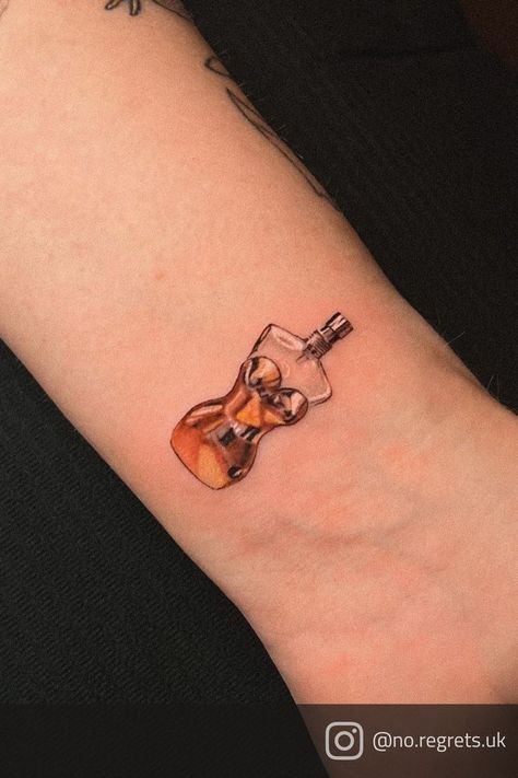 Micro realistic tattoo of Jean Paul Gaultier's Classique perfume bottle done by Romulo at No Regrets Tattoo Studio Cheltenham Tattoo Perfume, Perfume Bottle Tattoo, Regrets Tattoo, John Paul Gaultier, No Regrets Tattoo, Bottle Tattoo, Lyric Tattoos, Bad Tattoos, Incredible Tattoos