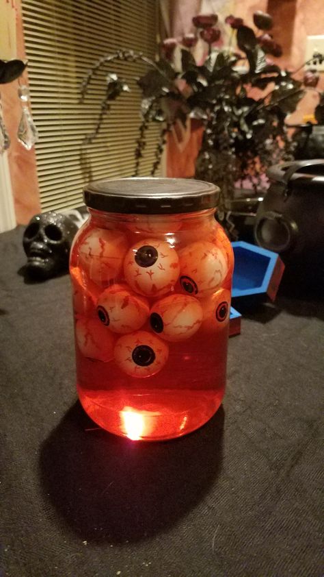 Creepy Things In Jars, Oddities Halloween Decor, Eyeballs Halloween Decorations, Halloween Head In A Jar Diy, Eye Ball Halloween Decorations, Eyeballs In A Jar Halloween, Halloween Eyeballs In A Jar, Eyeball Decorations Halloween, Diy Eyeballs Halloween