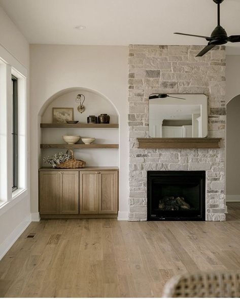 Tall Wall Living Room, Brick Arch Fireplace Ideas, Arches Next To Fireplace, Fireplace With Built In On One Side, Basic Fireplace Makeover, White Brick Fireplace With Wood Mantle Built Ins, Stone Indoor Fireplaces, Stone Fireplace With Built Ins On Both Sides, Fireplace Bookcase Built Ins