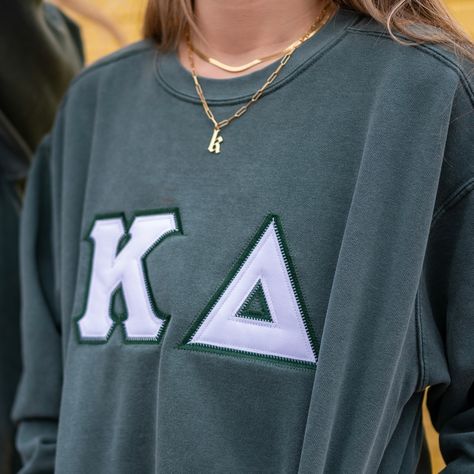 This unique & trendy Basic Greek Letter Comfort Colors Crew Neck Sweatshirt is sure to stand out on any campus!  Grab one for you, your favorite sister, or a group of sisters (chapter discounts offered - see below for more information). Pictures Featuring:  1-2. Blue Spruce sweatshirt w/ Dark Green background fabric color & White top fabric color  3. Grey sweatshirt w/ White background fabric & Light Pink top fabric AND White sweatshirt w/ White background fabric & Light Pink top fabric 4. Grey sweatshirt w/ White background fabric & Light Pink top fabric 5. Violet sweatshirt w/ Black background fabric & White top fabric 6. Blue Jean sweatshirt w/ Navy background fabric & White top fabric color There are 5 parts to your Greek Letter Sweatshirt: 1. T-shirt Color 2. T-shirt Size 3. Top Fabri Sewn Ons Sorority, Greek Letter Shirt, Fraternity Letters Sweatshirts, Sorority Sweater Letters, Letters Sorority Sweatshirt, Letter Shirts Sorority, Sorority Letters Shirt, Diy Sorority Sweatshirt, Sorority Embroidered Sweatshirt