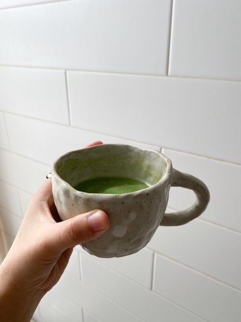 A lumpy hand-pinched mug pairs great with my morning matcha latte💚 Pinch Pots Mugs, Simple Handbuilding Pottery, Ceramic Mug Pinch, Ceramic Pinch Pot Mugs, Pinch Pot Coffee Mugs, Handmade Ceramics Aesthetic, Handmade Coffee Mug, Hand Pinched Pottery, Hand Pinched Mugs