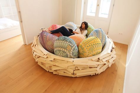 The nest comes with egg-pillows of various colors and is surrounded by a handsome pinewood border that looks like a woven bird’s nest Upcycling Design, Nest Bed, Nest Design, Whimsical Home, Couch Furniture, Wooden Bed, Bird Nest, Colorful Pillows, Unique Furniture