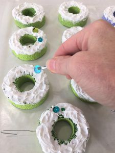 DIY Christmas Donut Ornaments:  Using Pool Noodles.  try these 2 tutorials using whipple cream & cotton balls to make donuts.  thetarnishedjewelblog.com Fake Icing, Donut Craft, Pool Noodle Wreath, Sprinkle Kindness, Donut Ornament, Pool Noodle Crafts, Christmas Party Planning, Diy Christmas Candy, Christmas Donuts