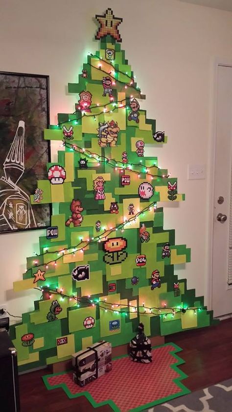 Christmas Tree For Every Holiday, Geek Art Decor, Game Room Christmas Decor, Anime Christmas Decorations, Nerdy Apartment Decor, Geek Christmas Tree, Nintendo Bedroom Ideas, Mario Room Ideas, Mario Themed Cat Tree