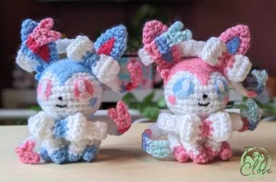 normal and shiny sylveon crochet pattern Crochet Sylveon, Pokemon Sylveon, Stitch Crafts, Pokemon Crochet Pattern, Crochet Pokemon, Pokemon Pattern, Crochet Tutorial Pattern, Plushie Patterns, Kawaii Crochet