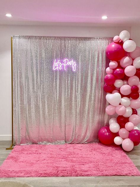 Silver sparkly curtains used as a photo back drop with a neon sign that says let's party, pink and white balloons, and a hot pink furry rug Barbie Backdrop Photoshoot, Y2k Photo Booth Ideas, Pink Photo Booth Backdrop, Barbie Birthday Ideas, Barbie Photo Booth, Pink Photo Booth, Cute Backdrops, Birthday Foods, Y2k Birthday Party