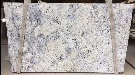 White Ice - A white and creamy background stone with rich blue & gray veining White Granite With Blue Veins, Galaxy White Granite Countertops, White And Blue Countertops, White Granite With Grey Veins, Granite Kitchen Countertops Colors, White Ice Granite Countertops, Bbq Counter, Moon White Granite, Light Colored Granite