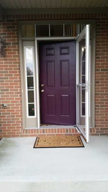 I like the look of dark purple against the brick. We could paint the blue part gray or taupe! - NV Bedroom Colors Purple, Purple Front Door, Purple Front Doors, Colors With Red Brick, Best Front Door Colors, Exterior Door Colors, Shutter Colors, Red Doors, Front Door Paint