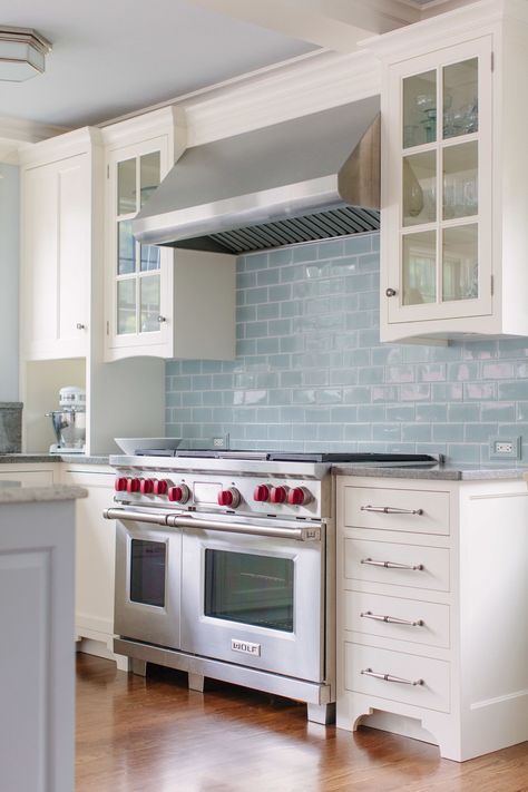 Icy blue subway tile is a fetching counterpoint to white cabinetry (and gives hardworking white subway tile a break) in this traditional kitchen. Blue Subway Tile, Серая Кухня, Bold Kitchen, White Kitchen Backsplash, Classic White Kitchen, Blue Backsplash, Kitchen Cabinets Decor, Kitchen Cabinets Makeover, Subway Tiles