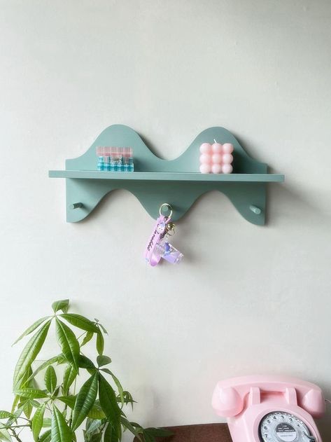 PRICES MAY VARY. EASY TO INSTALL: This sage green wall shelf with key holder will make your space feel a cozy home forever. You'll fall in love with the effortless look and curved shelf to hold your dreamiest items. Playful small shelf decor with a wavy design that brings an unexpected accent to a sleek profile. FUNCTIONAL &UNIQUE: With organic shaping that creates a wavy, blob silhouette, this hanging wall shelf with hanger infuses your space with a whimsical-meets-modern look we love. This sag Sage Green Shelf, Cute Hooks For Wall, Cute Wall Hooks, Baman Piderman, Light Green Decor, Room Sage Green, Blue And Pink Living Room, Curved Shelf, Purse Rack