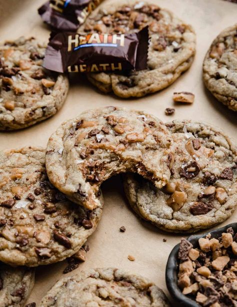 I feel like most Heath Bar cookies recipes never have enough toffee, which is why I've loaded these up with what I think is the right amount (hint: it's a lot). If you also love the combination of toffee and chocolate, you're going to love these cookies, which also have the perfect texture: crisp edges with soft and chewy centers. English Toffee Cookies, Heath Bar, Heath Cookies Recipes, Heath Bits Recipes, Chocolate Chip Heath Bar Cookies, Heath Pieces Recipes Toffee Bits, Heath Cookies, Heath Candy Bar, Heath Bar Cookies