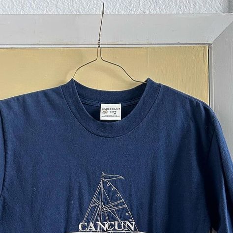 Reselling Denver on Instagram: "Vintage embroidered tshirt. Navy blue shirt and cream Cancun sailboat embroidery. Labeled a medium but fits baggy. Would be good for distressing. Granola girl, coastal, outdoorsy. $16+ ship #resellingdenver #granolagirl" Granola Tshirts, Granola Graphic Tees, Navy Blue Shirts, Granola Girl, Embroidered Tshirt, Blue Shirt, Cancun, Granola, Navy Blue