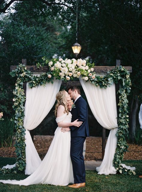 So much love between the bride and groom under a rustic floral and garland covered wedding arch: http://www.stylemepretty.com/little-black-book-blog/2016/08/09/california-spring-wedding-overflowing-sweetness/ Photography: Ashley Kelemen - http://ashleykelemen.com/ Wedding Drapery, Wedding Ceremony Ideas, Wedding Ceremony Arch, Wedding Altars, Ceremony Arch, Outdoor Wedding Ceremony, Festival Wedding, Tulle Wedding, Crystal Wedding