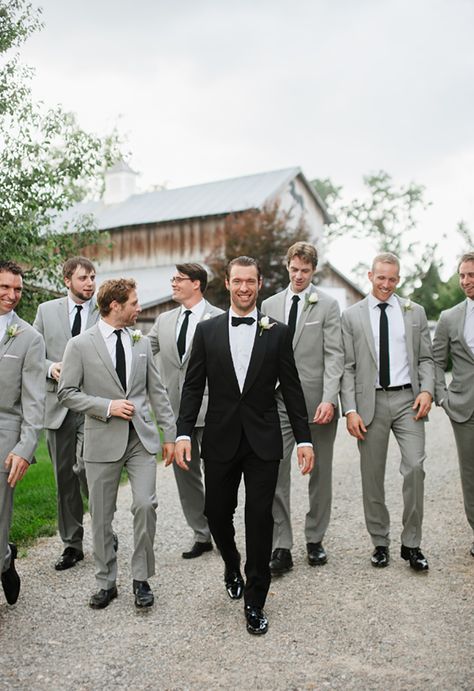 The groom looks dapper in his black tux and bow tie with the groomsmen in light gray suits with black ties ~ we ❤ this! moncheribridals.com Suits And Ties, Gray Groomsmen Suits, Groomsmen Outfit, Groomsmen Poses, Wedding Groomsmen Attire, Groom And Groomsmen Suits, Groomsmen Grey, Makeup Bride, Happy Model