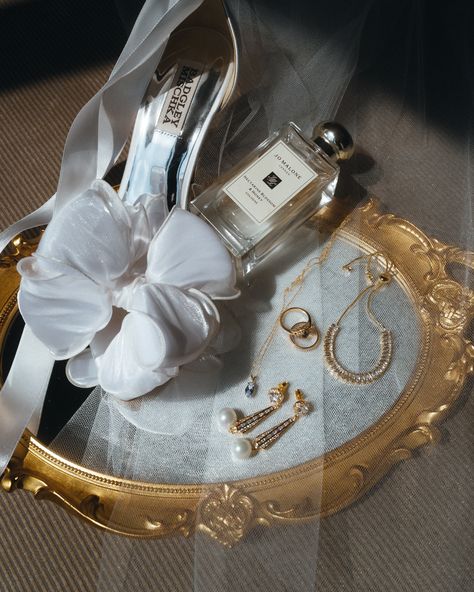 Jo Malone London Badgley Mischka Amélie George Bridal | Modern Wedding Accessories photo by weddings by md, wedding band by James and Sons | white satin bridal shoes, bow heels, pearl drop bridal earrings, vintage gold ring, wedding perfume, wedding fragrance, nectarine blossom and honey, aquamarine necklace, something old something new something borrowed something blue, editorial wedding details Jo Malone Wedding Perfume, Wedding Heirloom Ideas, Ring Box Wedding Photo, Bridal Product Photography, Old Money Wedding Details, Bridal Accessories Photography, Details Photo Wedding, Vintage Wedding Details, Jo Malone Wedding