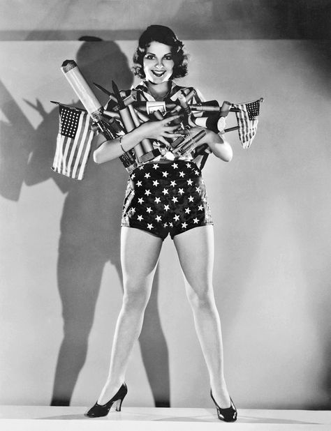 July 4th: Colorized Vintage Photos of Pin-up Models | Time Lilian Bond, American Flag Photos, Pin Up Models, Patriotic Fashion, Vintage American Flag, Flag Photo, Classic Actresses, Bag Essentials, Hollywood California