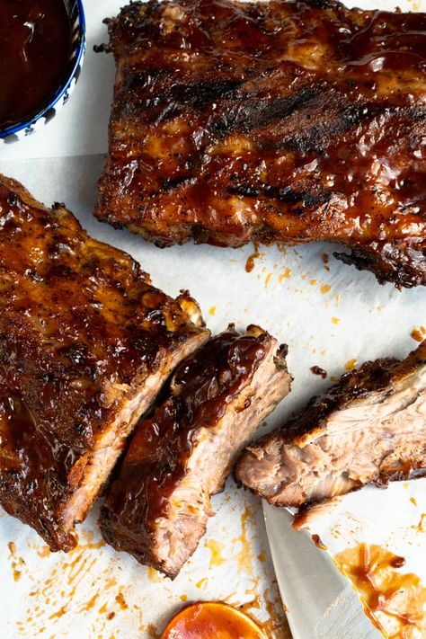 These Fall Off The Bone Baby Back Ribs are the best ever! Marinated for 8 hours in a to die for the dry rub and then slow-roasted in the oven for 3-4 hours. #falloffthebonebabybackribs #bbqbabybackribs #babybackribsintheoven #besteverribs #besteerribsintheoven Fall Off The Bone Baby Back Ribs In Oven, Marinate For Ribs, Slow Cooked Oven Ribs, Beef Ribs In Oven, Ribs Marinade, Oven Baked Beef Ribs, Back Ribs In Oven, Baked Beef Ribs, Babyback Ribs