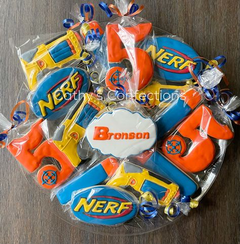 Nerf Cookies Decorated, Nerf Cookies, Nerf Cake Ideas, Nerf Party Decorations, Nerf Birthday Cake, Nerf Birthday Party Ideas, Nerf Cake, Hotwheels Birthday Party, Nerf Birthday Party