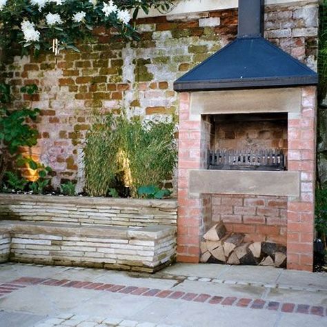 7 of the Most Perfect Outdoor Fireplaces | ELB Fireplaces Small Courtyard With Fireplace, Brick Garden Fireplace, Red Brick Outdoor Fire Pit, Red Brick Courtyard, Courtyard Fireplace, Cottage Courtyard, Courtyard Garden Ideas, Large Courtyard, Bbq Hut