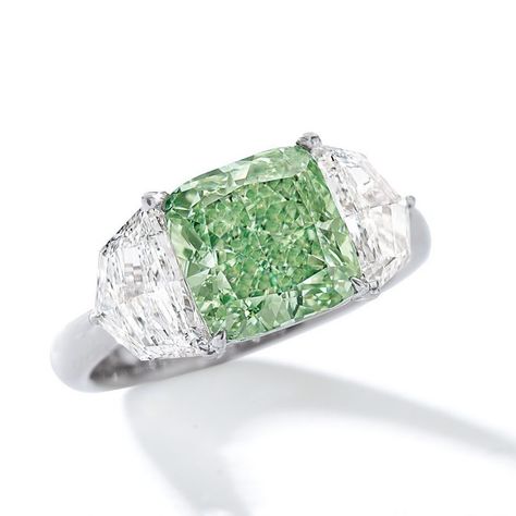 And to wrap up our dream green selection from Sotheby's Magnificent Jewels and Jadeite sale on April 2: This ring set with a 3.05-carat round-cornered square modified brilliant-cut fancy intense green diamond, between two shield-shaped diamonds, mounted in 18 karat white gold. Green Diamond Jewellery, Green Diamond Ring, Green Diamond Rings, Colored Diamond Jewelry, Green Diamonds, Diamond Bracelet Design, Flawless Diamond, High Jewellery, Jewelry Brands