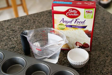 Make angel food cake in cupcake form and top with fresh berries and vanilla-bean whipped cream and you will have a heavenly little dessert. Betty Crocker Angel Food Cake Recipes, Individual Angel Food Cake Cups, Angel Food Cupcakes From Mix Boxes, Angelfood Cake Mix Cupcakes, Boxed Angel Food Cake Hacks, Angle Food Cupcakes, Small Angel Food Cake, Angel Food Cake In Bundt Pan, Angelfood Cupcakes