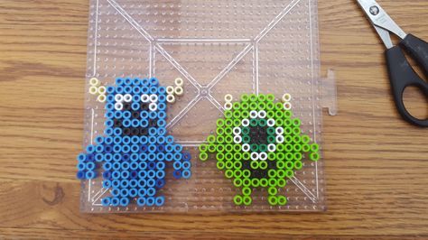 Perler Bead Mike and Sully (Monsters Inc) Monsters Inc Perler Beads, Sully And Mike, Mini Hama Beads, Mike And Sully, Hamma Beads Ideas, Easy Perler Bead Patterns, Melty Bead Patterns, Pearl Beads Pattern, Easy Perler Beads Ideas