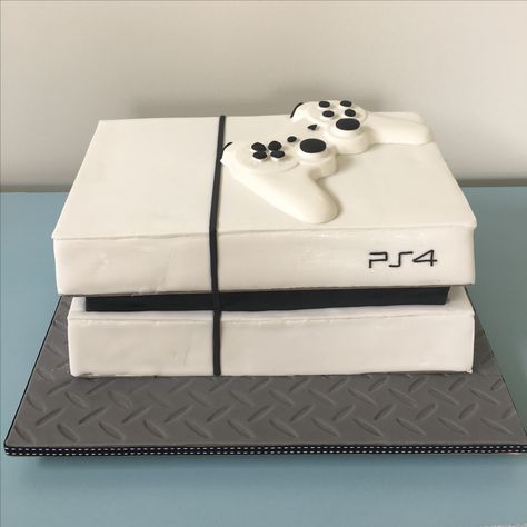 Play Station 4 gaming console dark chocolate mud cake covered in fondant and a solid white chocolate game control. Play Station Cakes For Boys, Pastel Play Station, Xbox One Cake, Ps4 Cake, Playstation Party, Playstation Cake, Xbox Party, Play Station 4, Dinosaur Birthday Cakes